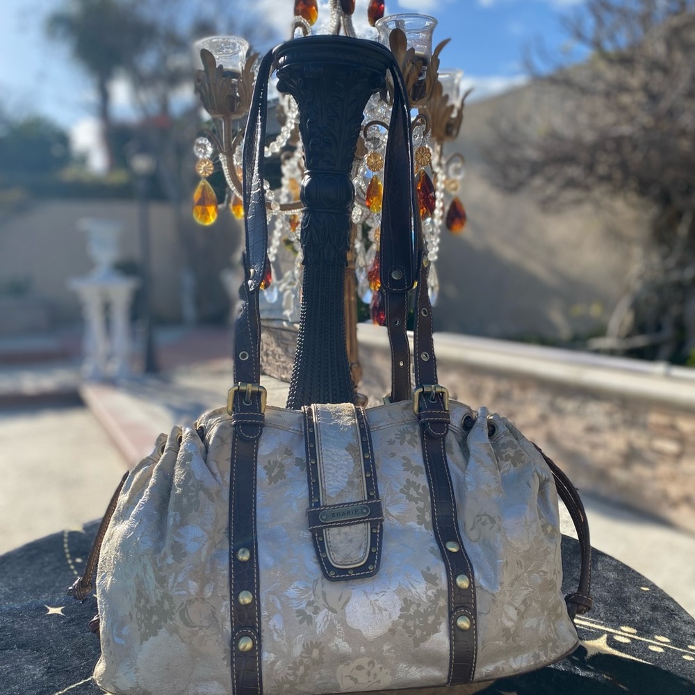 Sharif Vintage Satchel that is suede leather w/ contrasting leather straps.